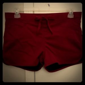 Mid rise burgundy shorts.